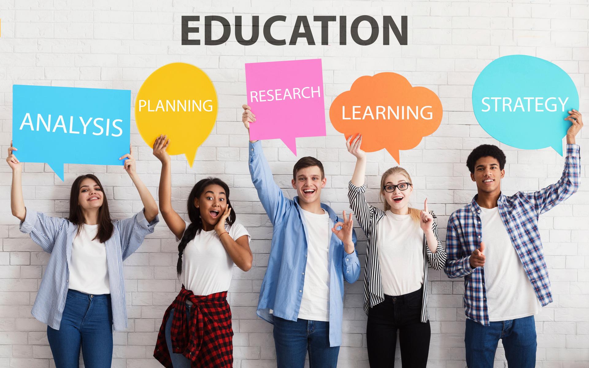Happy friends holding placards with features of successful education